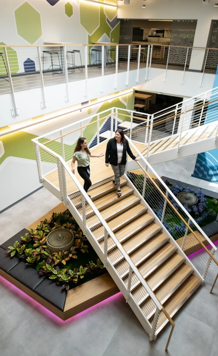 Employees walking down the stairs at TerraPower headquarters